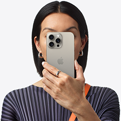 Person holding phone in front of their face.