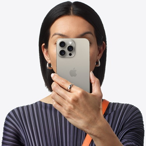 Person holding phone in front of their face.