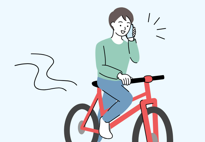 スマホで通話しながら自転車を運転している人のイメージ図